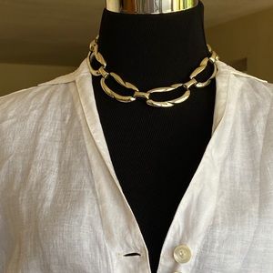 Gold tone metal choker. Feminine